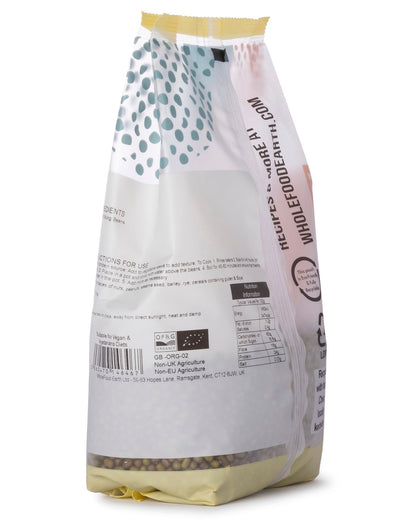 Organic mung beans from Whole Food Earth, small green pulses in a clear bowl, fresh and whole, ideal for cooking and healthy meals.