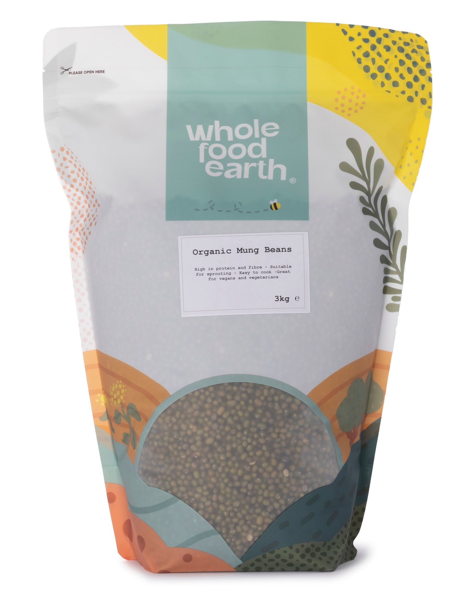 Organic mung beans from Whole Food Earth, displayed in a clear bowl showing small green pulses on a wooden surface.