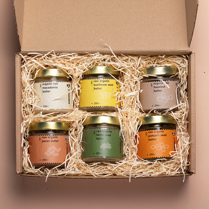 Assorted organic nut and seed butters in small jars from Whole Food Earth, displayed in the RAWGORILLA selection box.