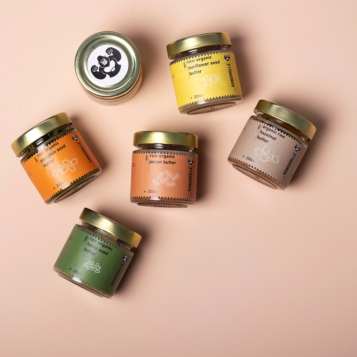 Assorted organic nut and seed butters in small jars from Whole Food Earth, displayed in a selection box.