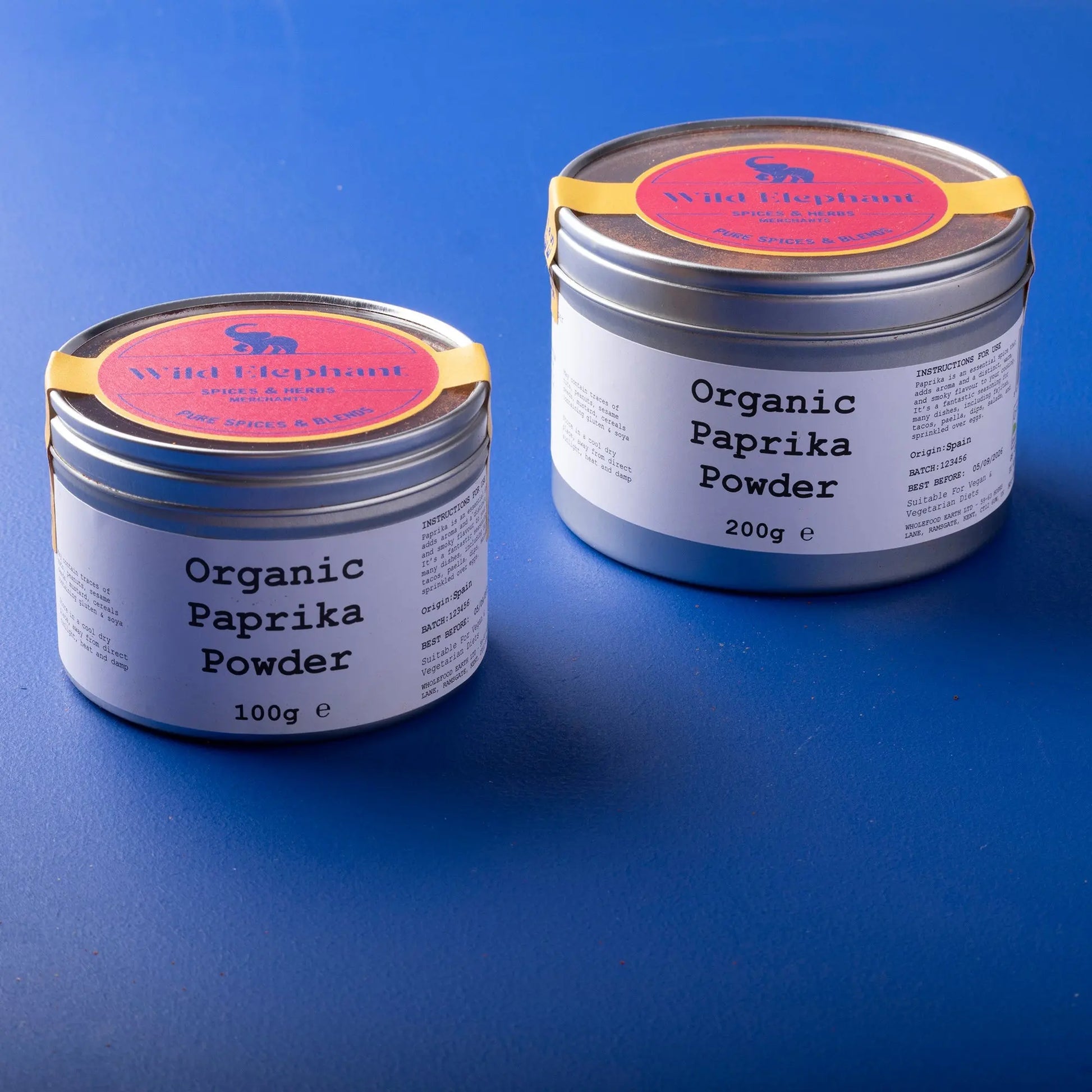 Organic paprika powder from Whole Food Earth, vibrant red spice in a clear jar, used for seasoning and adding flavor to dishes.