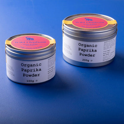 Organic paprika powder from Whole Food Earth, vibrant red spice in a clear jar, used for seasoning and adding flavor to dishes.
