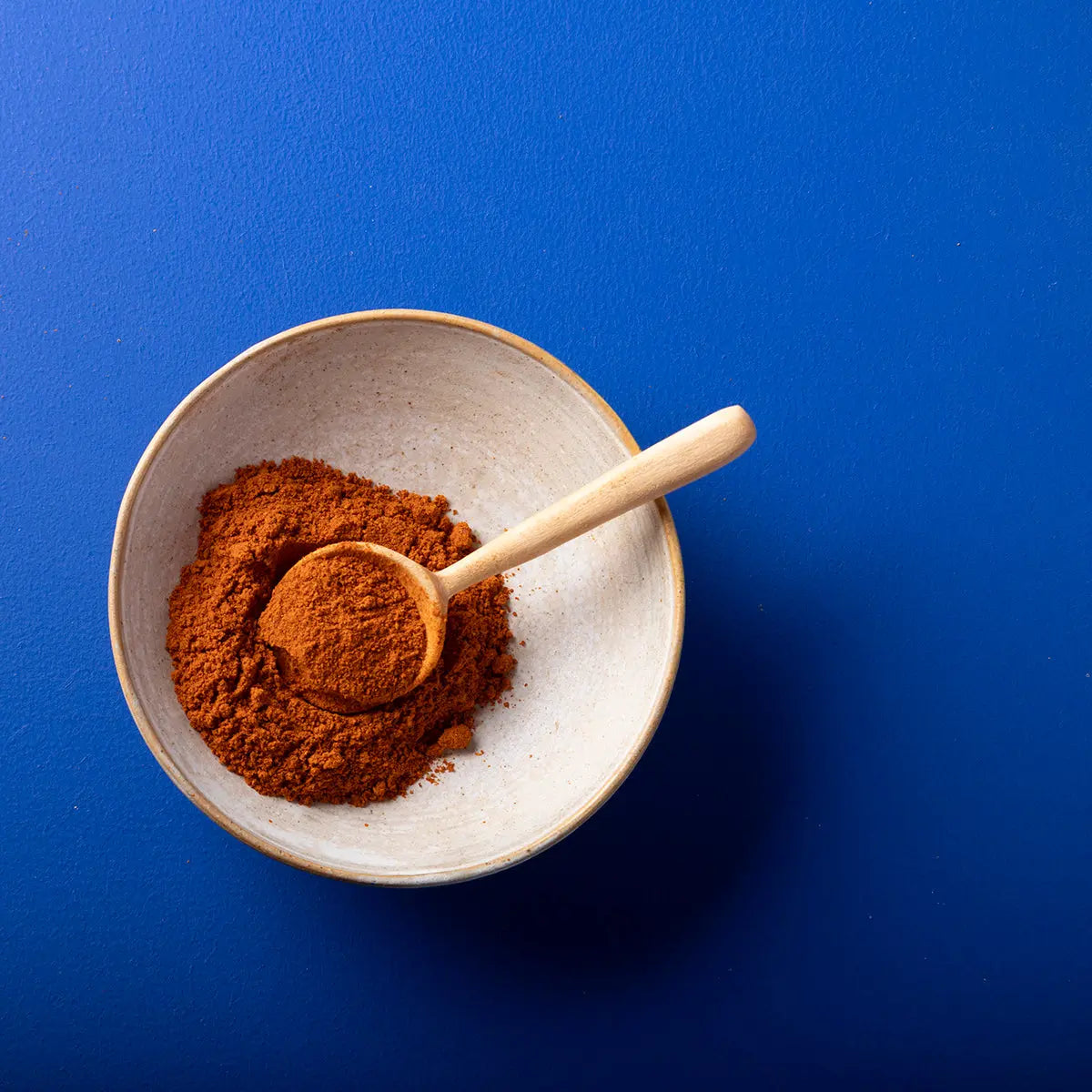 Organic paprika powder from Wild Elephant, a vibrant red spice in a clear jar, part of Whole Food Earth's herbs and spices collection.