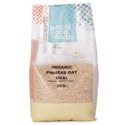 Organic Pinhead Coarse Oatmeal in a 2kg bag from Whole Food Earth, close-up of the coarse oat grains in the cereal package.