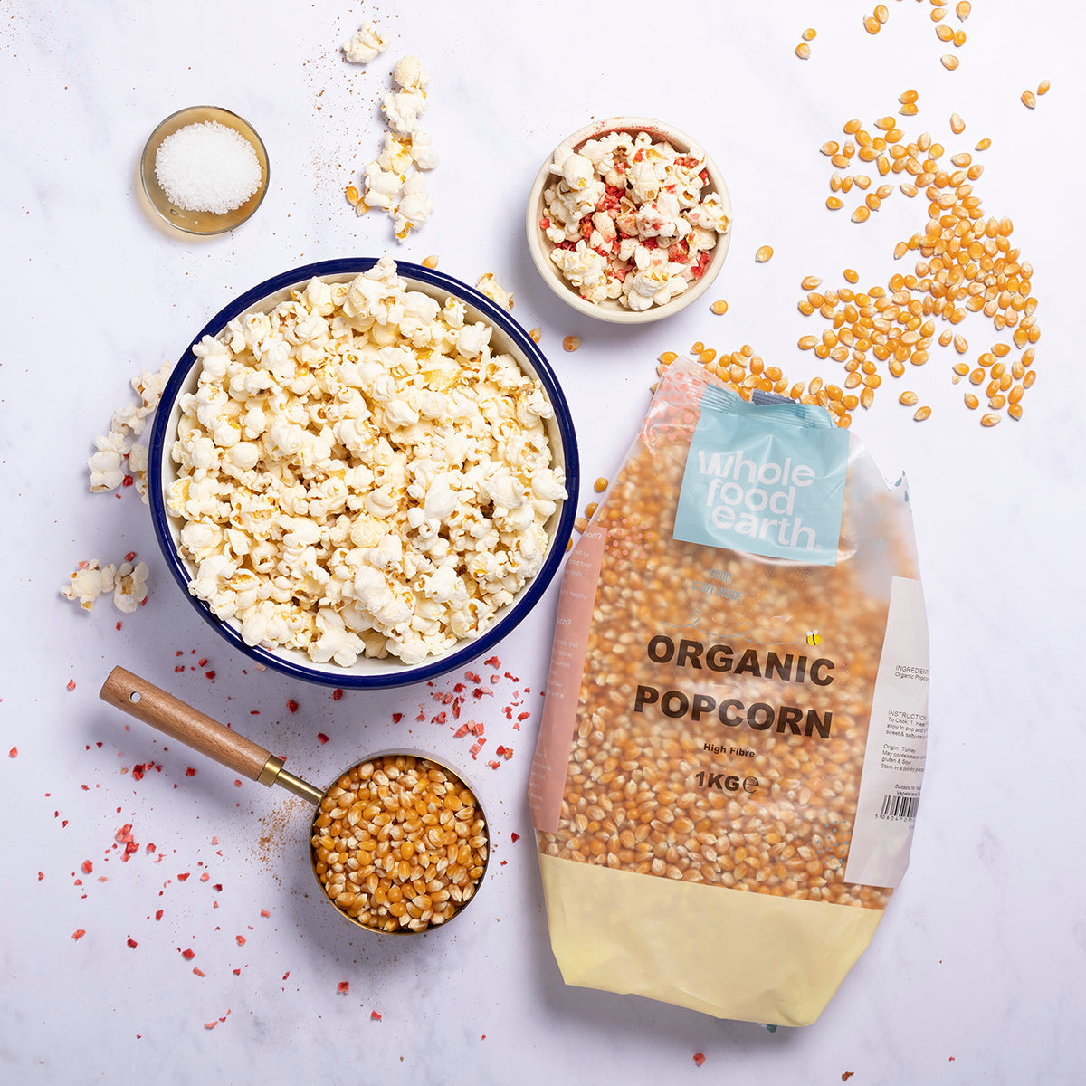Organic popcorn from Whole Food Earth in a bowl, showcasing the fluffy, popped grains on a rustic wooden surface.