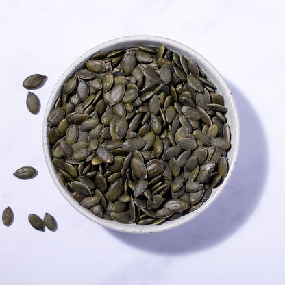 Organic Pumpkin Seeds from Whole Food Earth, showing fresh, raw pumpkin seeds in a close-up view.