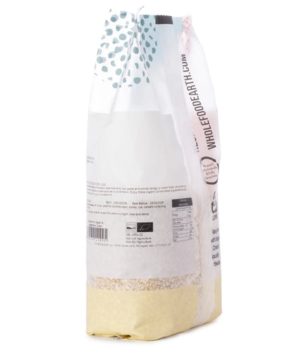 Organic quinoa flakes cereal from Whole Food Earth in a 500g package, showing light, fluffy flakes ready for breakfast.