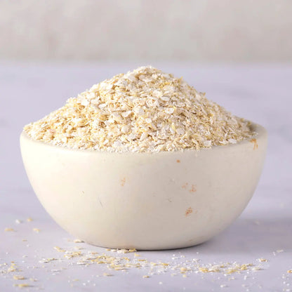 Organic quinoa flakes from Whole Food Earth, a healthy cereal option with visible flake texture and natural quinoa grains.