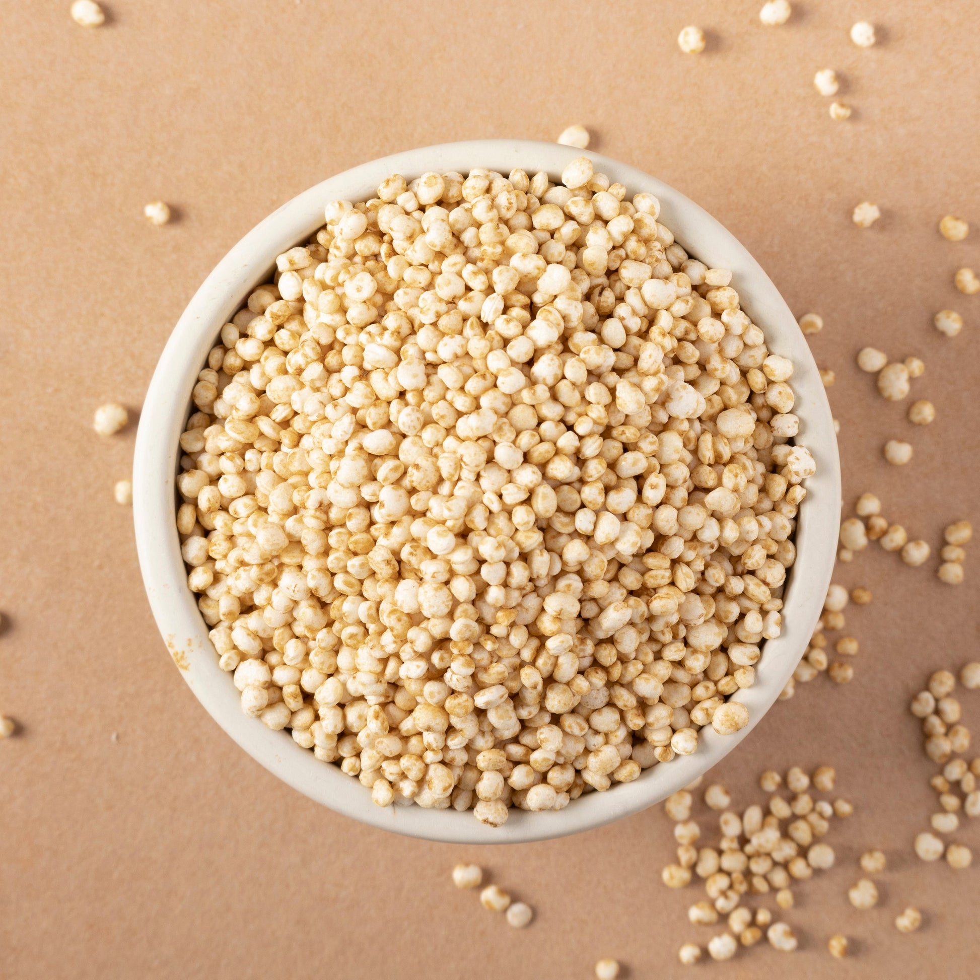 Organic quinoa puffs from Whole Food Earth, close-up of light, crispy grains in a bowl, highlighting natural, healthy cereal texture.