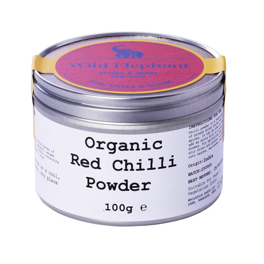 Organic red chili powder from Whole Food Earth, wild elephant brand, in a 100g package, vibrant red spice with a fine powder texture.