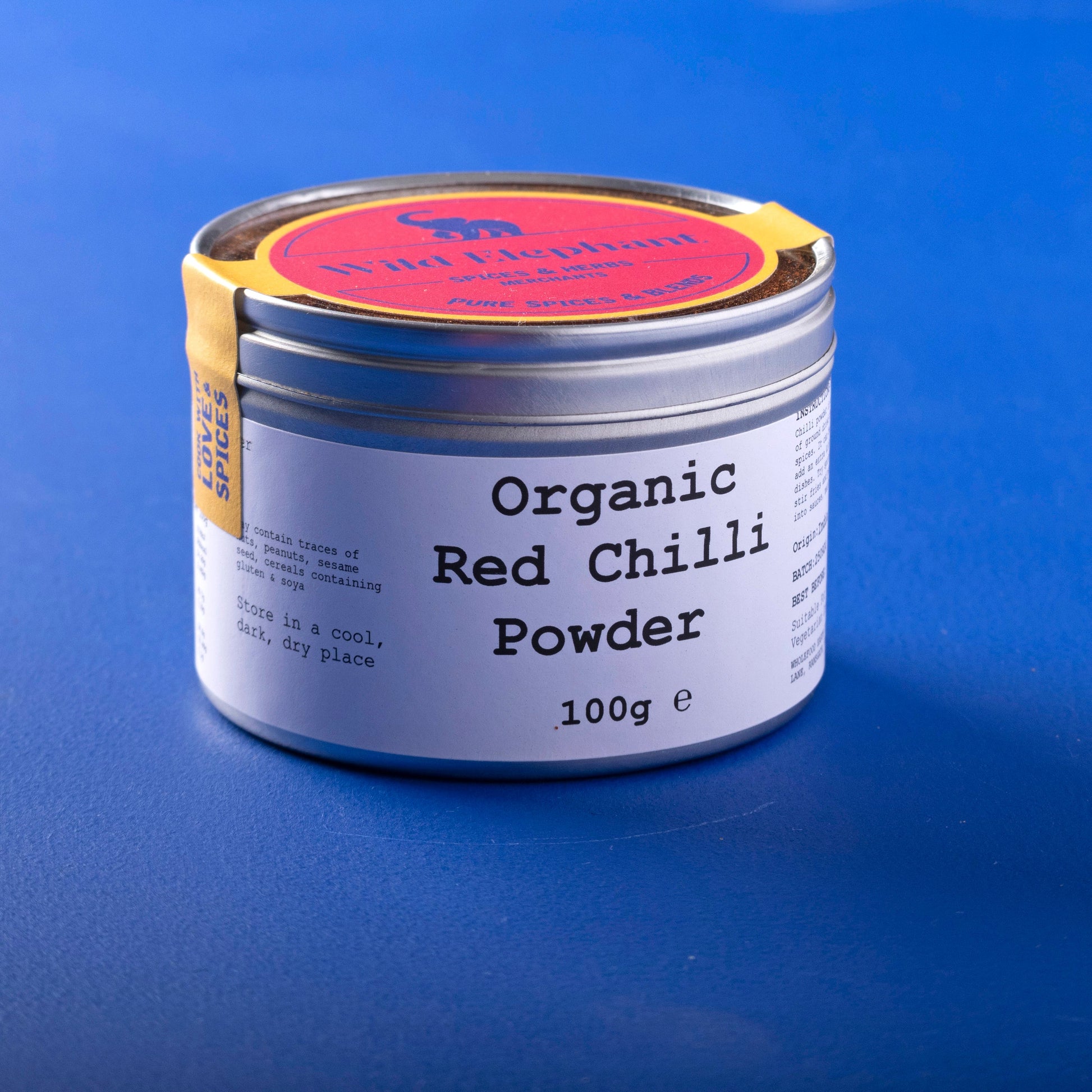 Organic red chili powder from Wild Elephant, 100g, in a spice jar, showcasing vibrant red chili powder for herbs and spices.