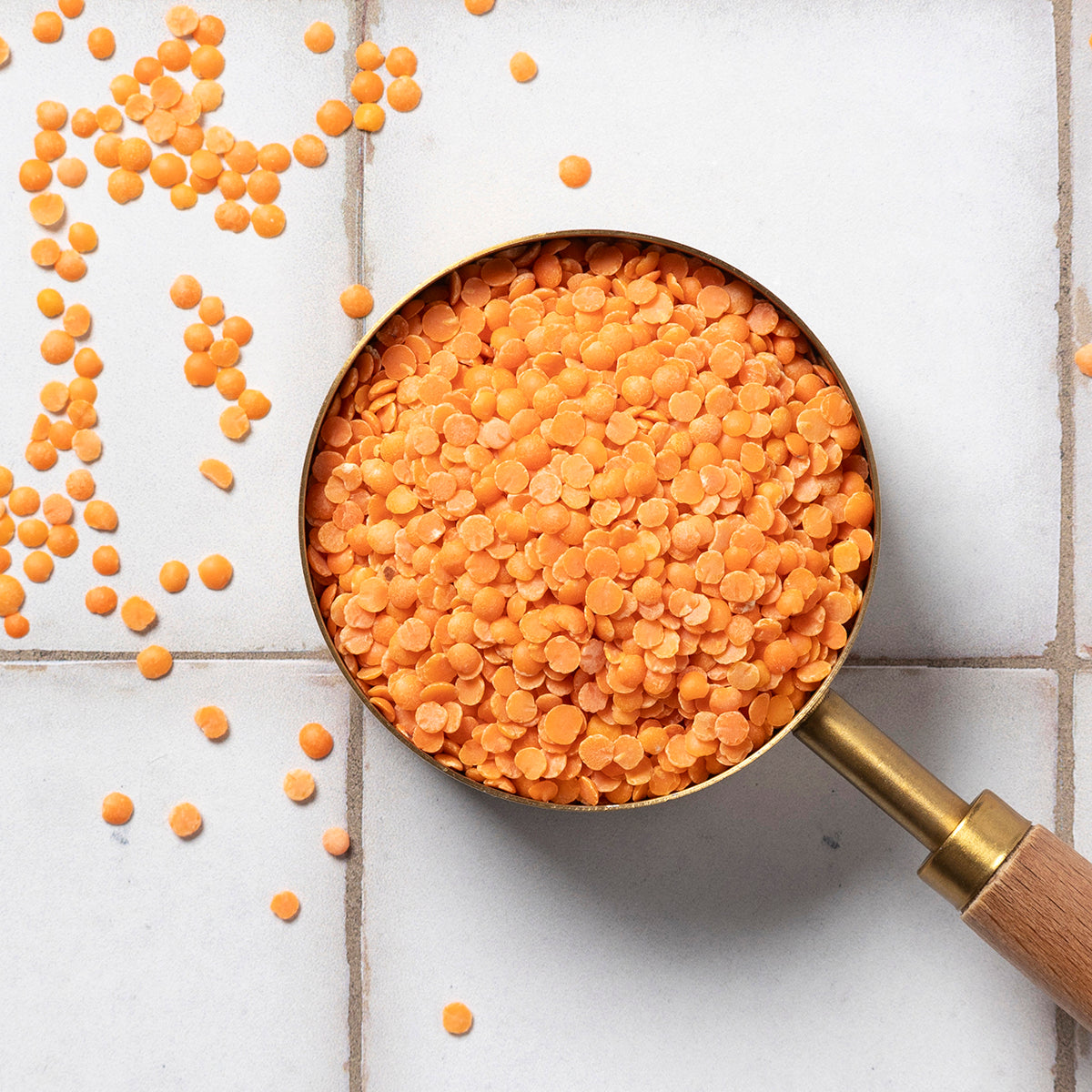 Organic red split lentils from Whole Food Earth, showing vibrant, uncooked red lentils in a close-up shot.