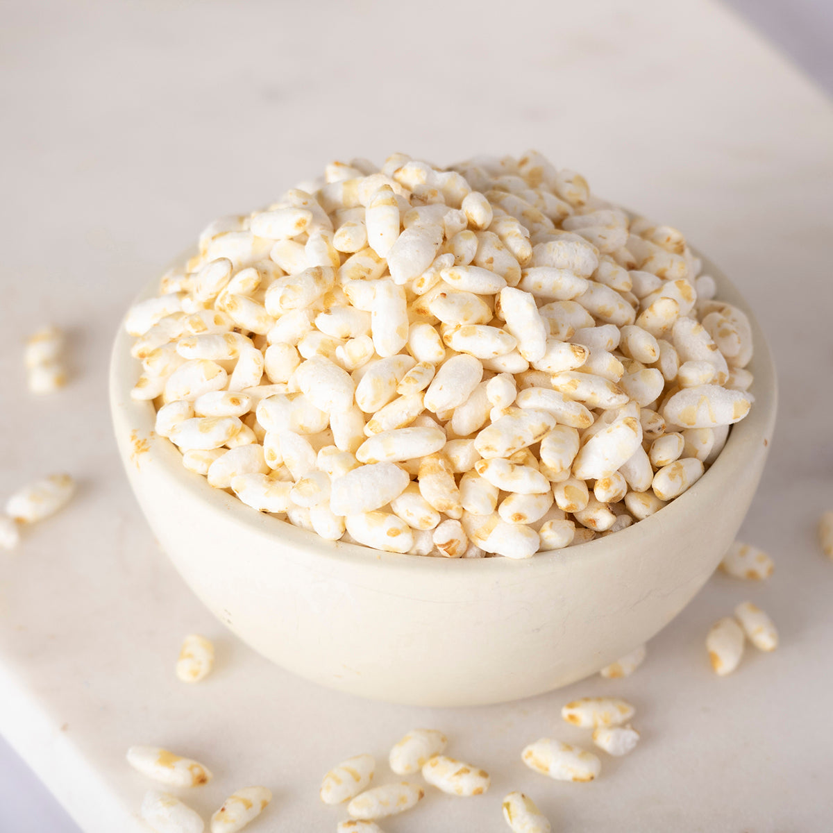 Organic rice puffs from Whole Food Earth, showing light, airy rice cereal grains suitable for snacks or breakfast.