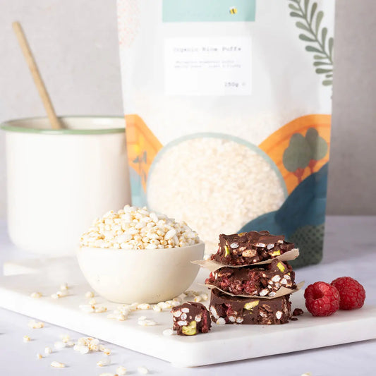 Organic rice puffs from Whole Food Earth displayed in a bowl, showcasing their light, crispy texture and natural rice appearance.