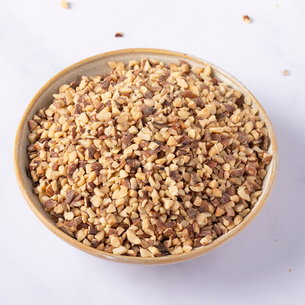 Organic roasted chopped almonds from Whole Food Earth, showing golden-brown chopped almonds in a bowl.