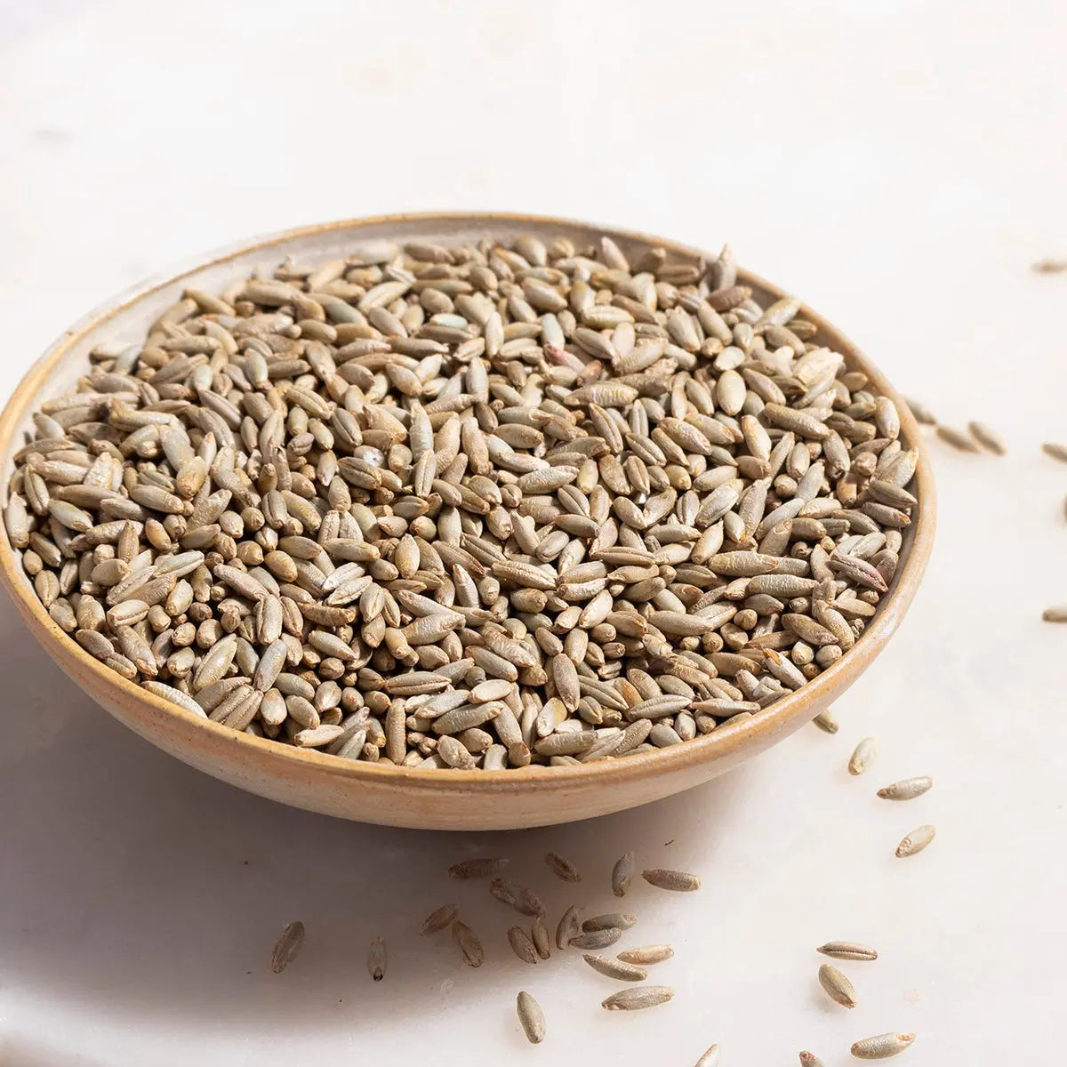 Organic rye grain from Whole Food Earth, showing whole, unprocessed rye kernels in a natural setting.