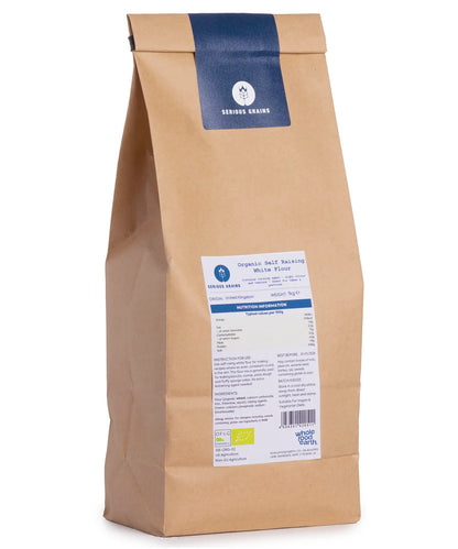 Organic self-raising white flour from Serious Grains by Whole Food Earth, 1kg bag, showing the flour in a clear package.