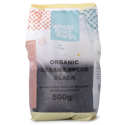 Organic black sesame seeds from Whole Food Earth, 500g pack, close-up view of small, shiny black seeds on a white background.