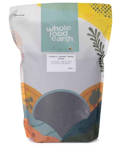 Black organic sesame seeds in a clear container, showing small oval seeds with a matte black finish, from Whole Food Earth.