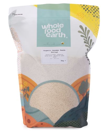 Hulled organic sesame seeds in a 3kg bag, natural light-colored seeds from Whole Food Earth, suitable for cooking and baking.