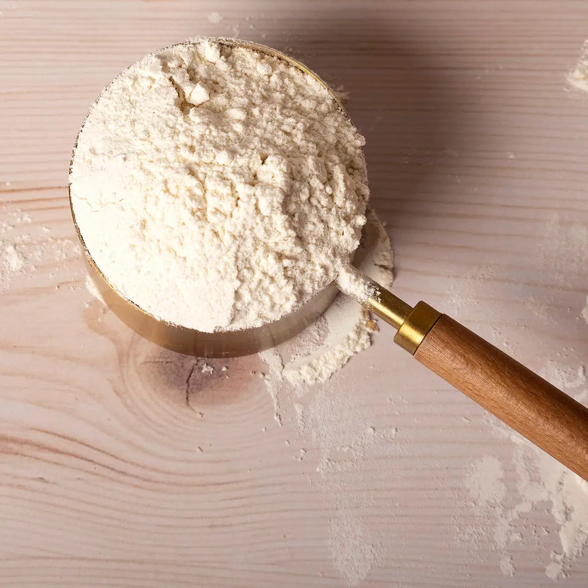 Organic Canadian strong white bread flour from Whole Food Earth, showing a bag of premium flour with grains in the background.