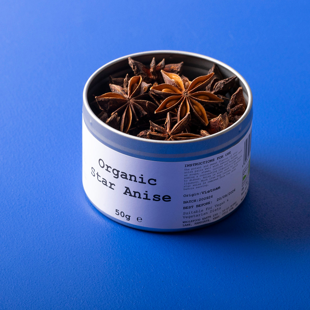 Whole Food Earth Organic Star Anise spice in a 50g package, featuring star-shaped dark brown pods, used in herbs and spices.