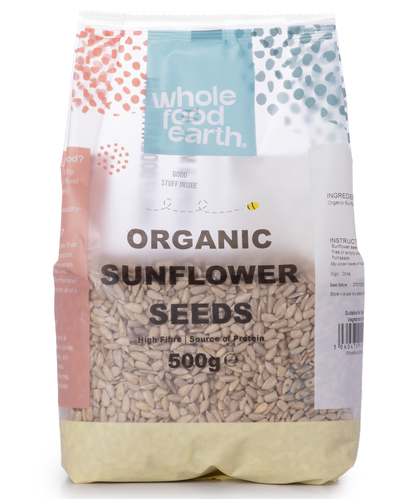 Organic sunflower seeds in a clear container, showing whole seeds from Whole Food Earth, 500g package, nuts and seeds category.