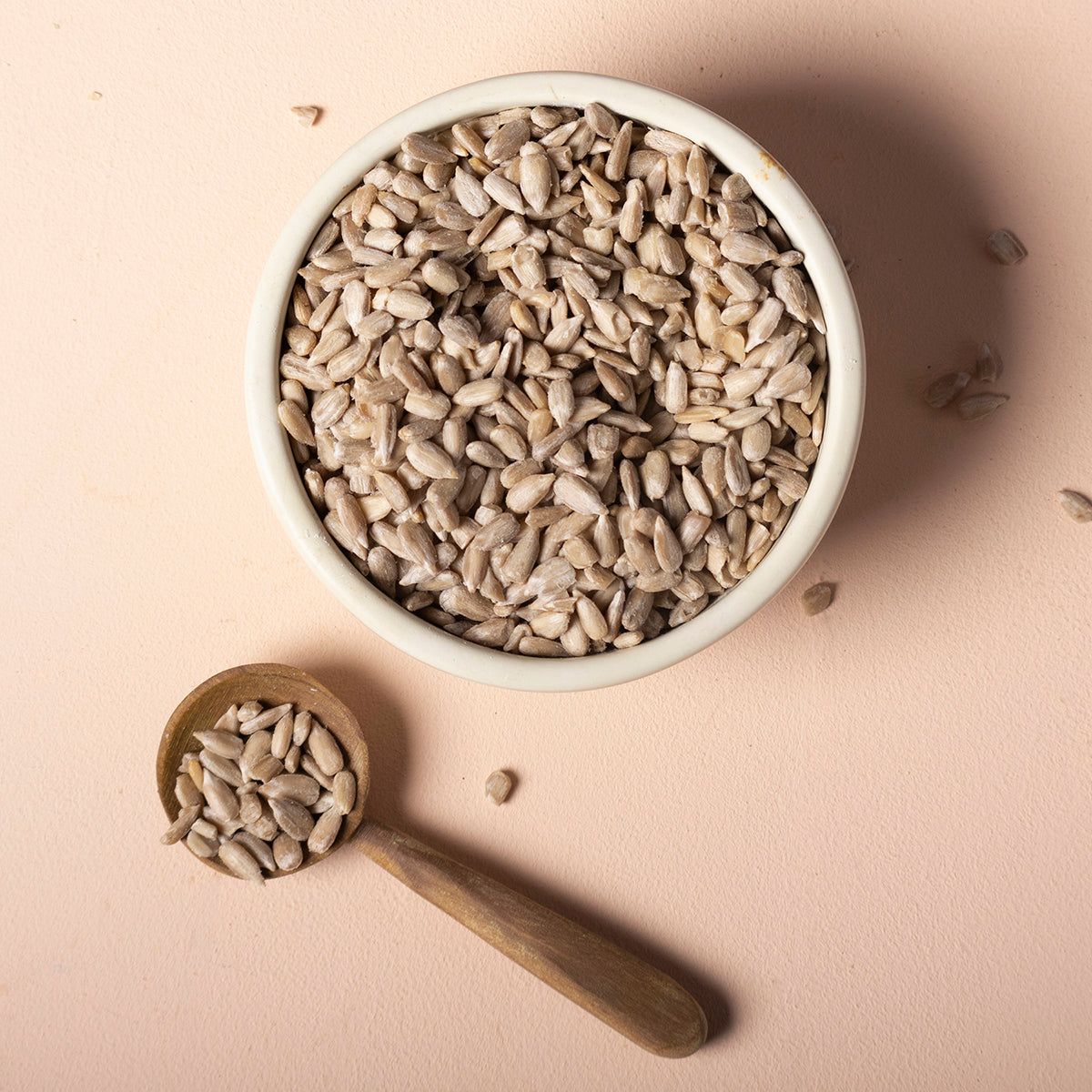 Raw organic sunflower seeds from Whole Food Earth, shown in a close-up of their natural, shelled form.