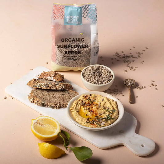 Organic sunflower seeds from Whole Food Earth, displayed in a natural setting, showcasing their fresh, crunchy texture.