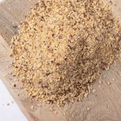 Organic toasted hazelnut flour in a jar, showcasing its light brown color and fine texture, perfect for baking from Whole Food Earth.