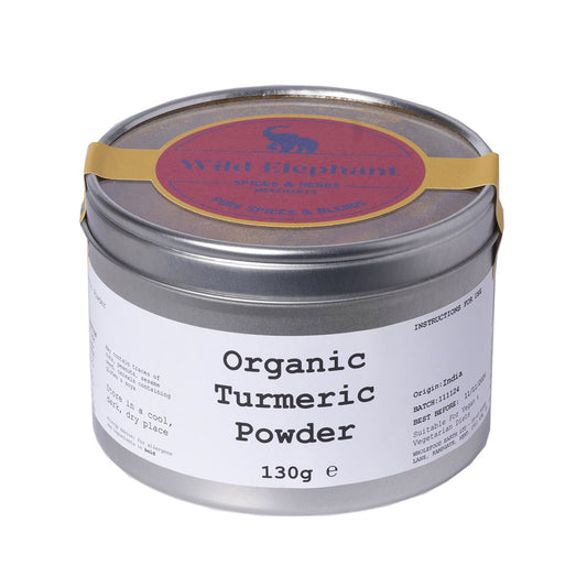 Organic turmeric powder by Wild Elephant in a 130g package, showcasing vibrant golden-yellow ground herb for cooking and health.