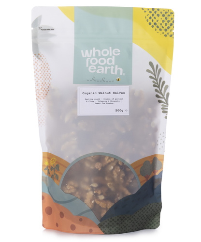 Organic Whole Food Earth walnut halves in a bowl, showing their natural brown color and irregular shape, on a neutral background.
