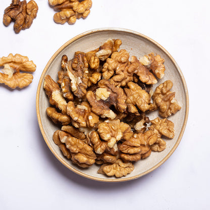 Organic Walnut Halves from Whole Food Earth, close-up of fresh, crunchy walnut pieces in a natural, wholesome nut and seed product.