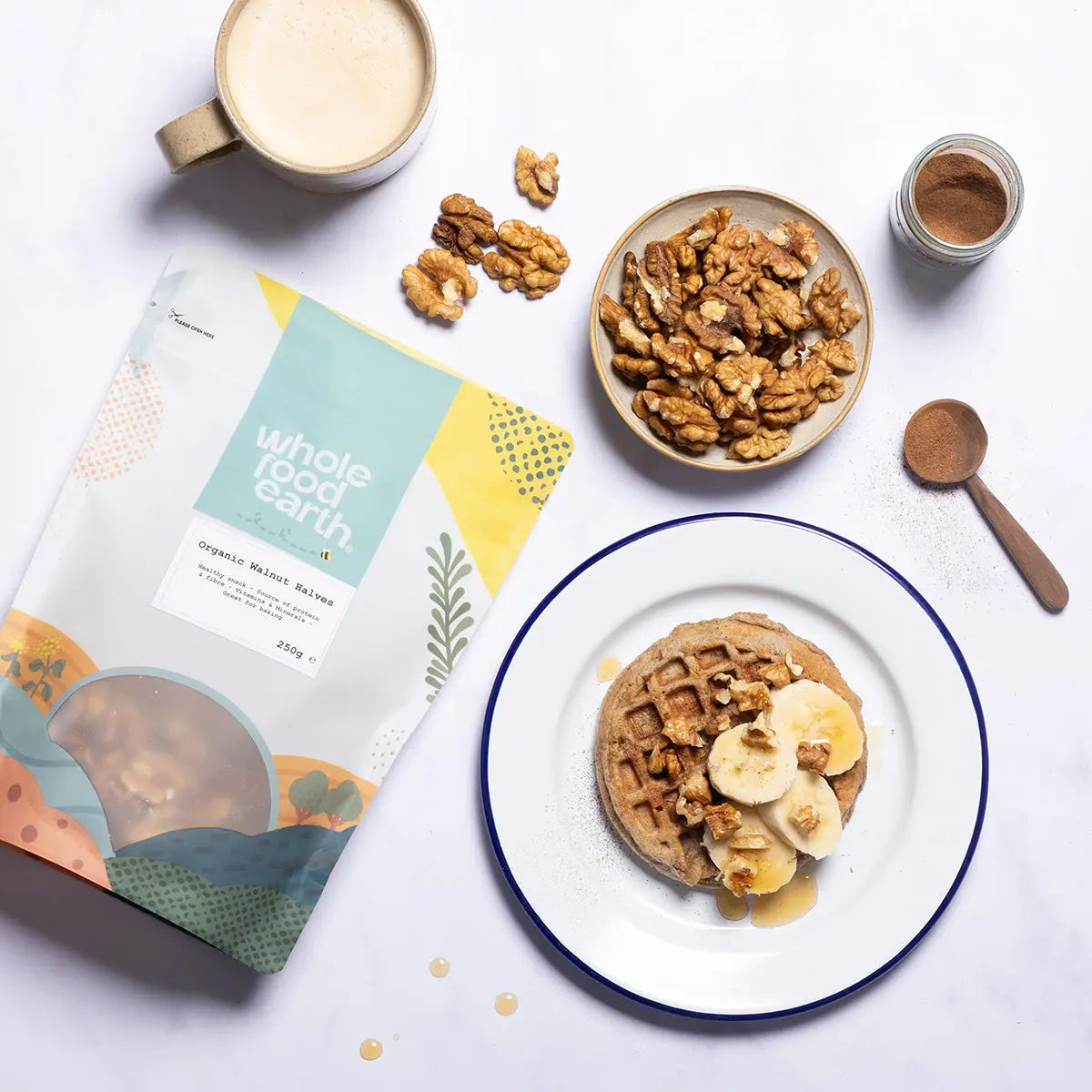 Organic Walnut Halves from Whole Food Earth, displayed in a bowl with fresh walnuts and a rustic background.