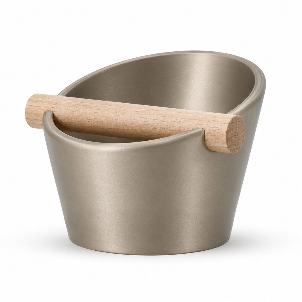 KNOCDIC® oval coffee knock box with metallic gold finish and real oak wood bar for espresso puck disposal.