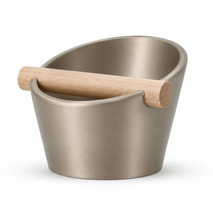 KNOCDIC® oval coffee knock box with metallic gold finish and real oak wood bar for espresso puck disposal.