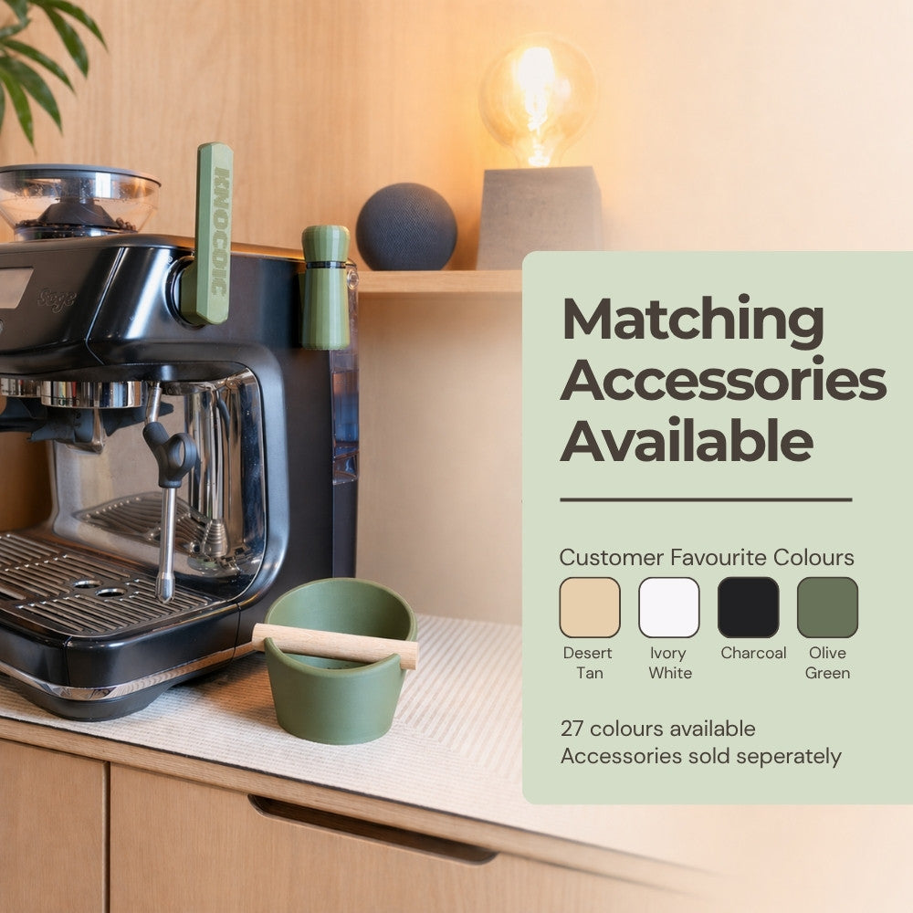 Oval coffee knock box by KNOCDIC® with a real oak wood bar for espresso machine cleaning and coffee preparation.
