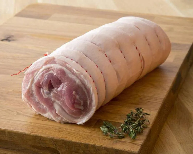 Boneless pork belly joint from Primrose Herd, showcasing fresh, skinless pork belly for roasting or roasting dishes.