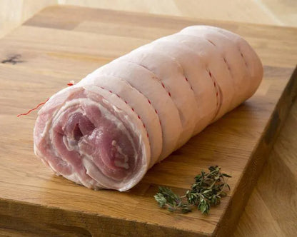 Boneless pork belly joint from Primrose Herd, showcasing fresh, skinless pork belly for roasting or roasting dishes.