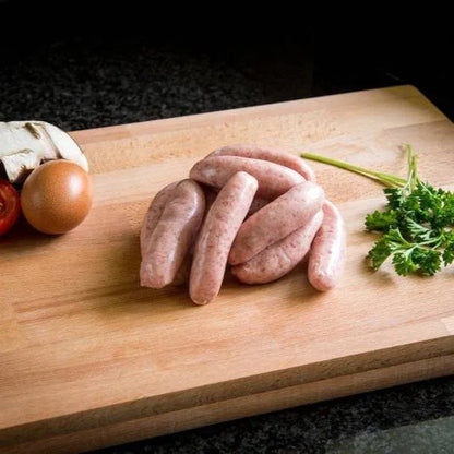Primrose Herd gluten-free cocktail sausages arranged on a serving platter, ready to serve as a snack or appetizer.