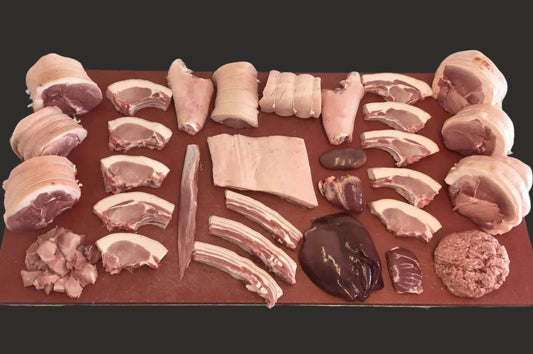 Half pig pork box from Primrose Herd featuring assorted cuts of fresh pork meat in a meat box package.