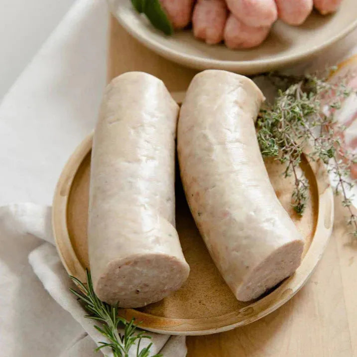 White pudding from Primrose Herd, Hogs Pudding, sliced and cooked, showing its creamy texture and traditional appearance.