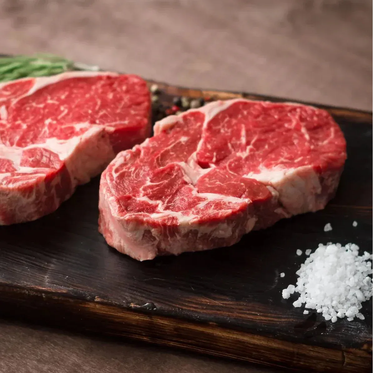 Premium dry-aged beef rib eye steak by Primrose Herd, showcasing marbled 500g beef steak with a rich, aged appearance.