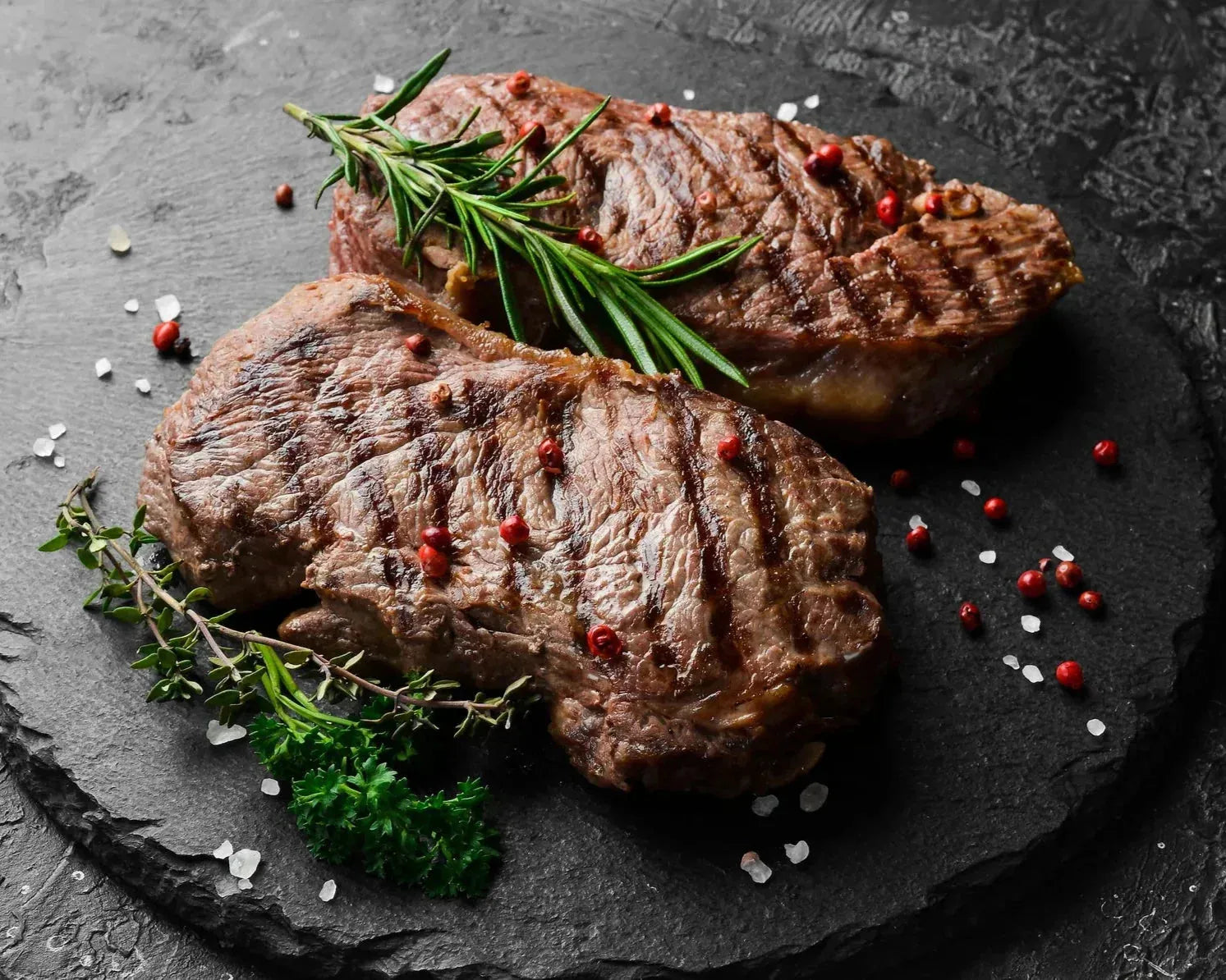 Prime dry-aged beef rib eye steak from Primrose Herd, 500g, with marbled texture and rich, deep red meat.