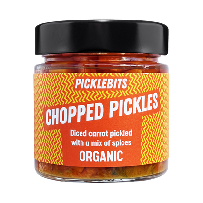 Jar of PICKLEBITS pickled carrots with a vibrant label with black lid.