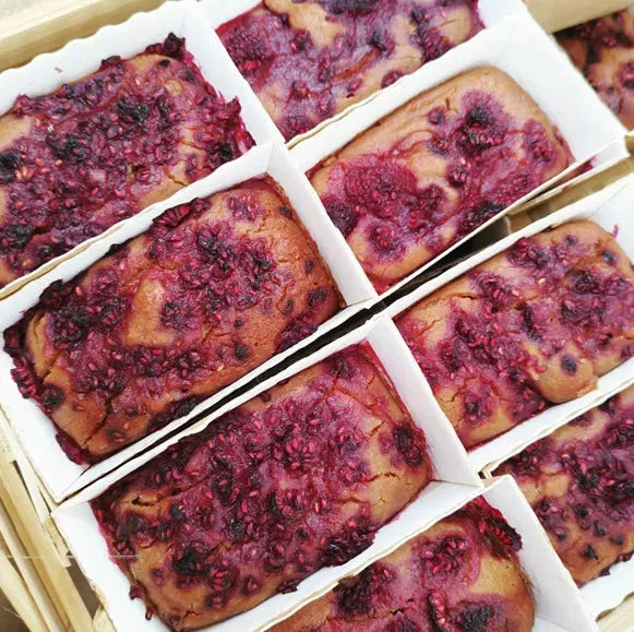 Vegan peanut butter and jam free-from cake from The Healthy Cake Company, sliced to show layers and filling.