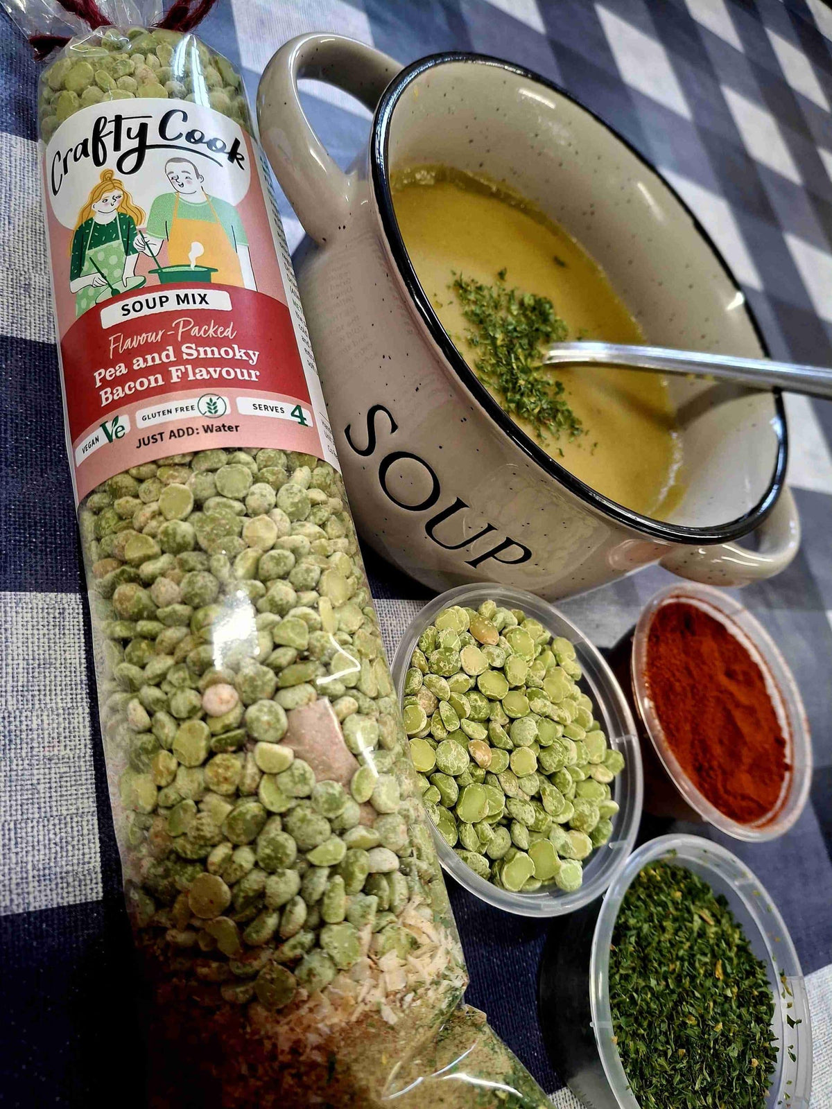 Crafty Cook Easy Meals starter plan featuring pea and smoky bacon flavored soup in a bowl with ingredients on a kitchen counter.