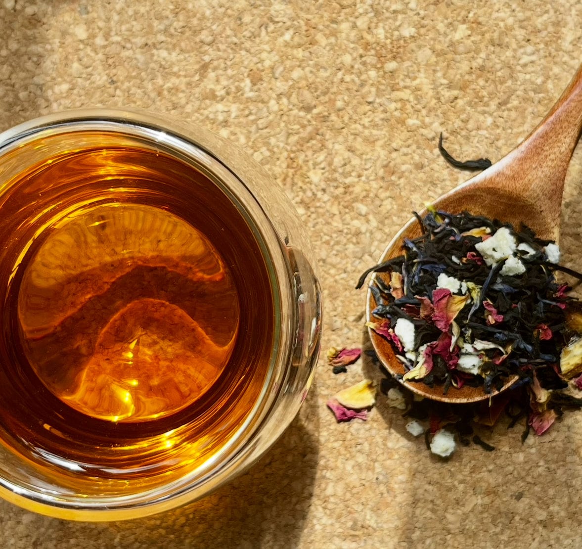 Loose leaf Pearl Grey black tea from Porter Hill Tea Company, showing silver-grey tea leaves in a clear container.