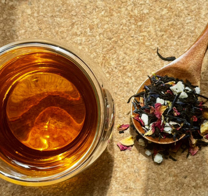 Loose leaf Pearl Grey black tea from Porter Hill Tea Company, showing silver-grey tea leaves in a clear container.