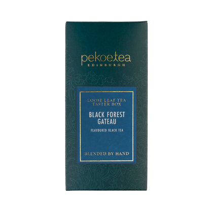 Loose leaf black forest gateau tea from PekoeTea Edinburgh with rich, dark chocolate and cherry flavors in a tea taster image.